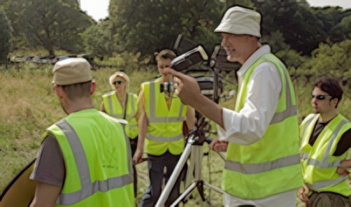 Directing the cast, on location